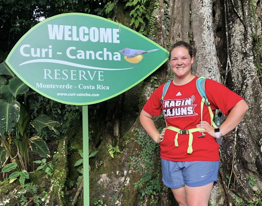 Student at Curi-Cancha Reserive in Coasta Rica wearing a Ragin' Cajuns shirt