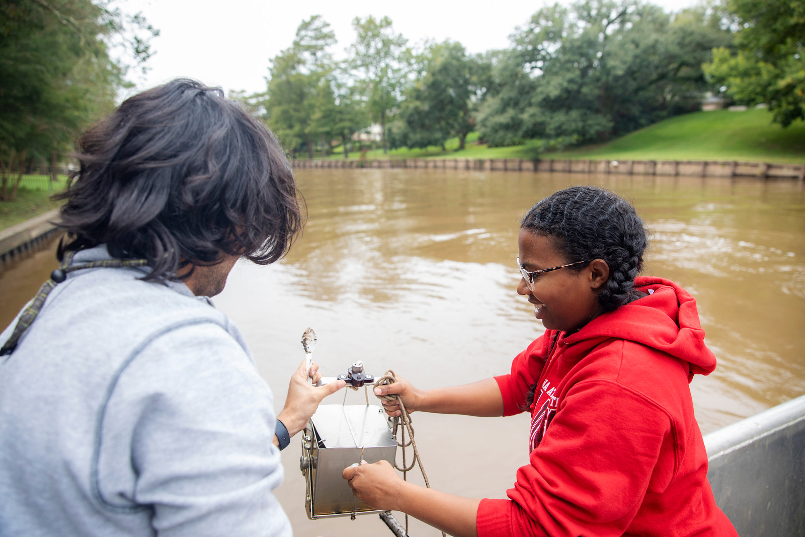 Students collecting sediment samples from the Vermilion River