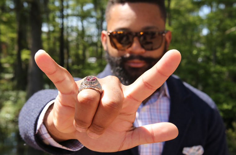 A UL Lafayette alum holding up his Louisiana ring to the camera. The University of Louisiana Ring is an important tradition for our college.
