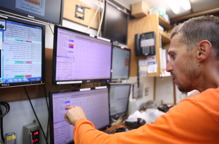 A University of Louisiana at Lafayette researcher analyzing data on a screen