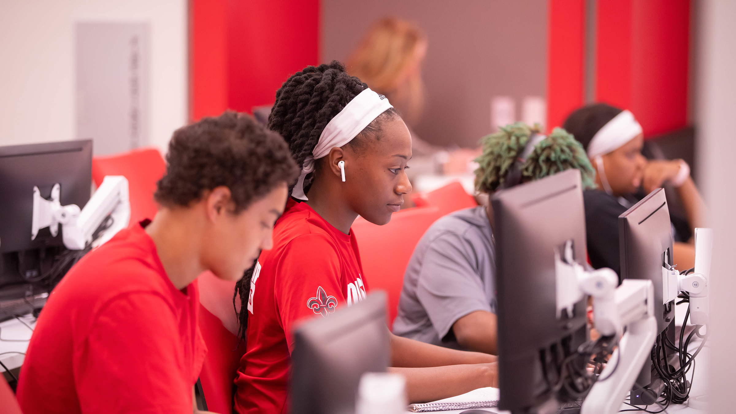 Ragin' Cajuns student-athletes work on computers in the Student-Athlete Academic Center