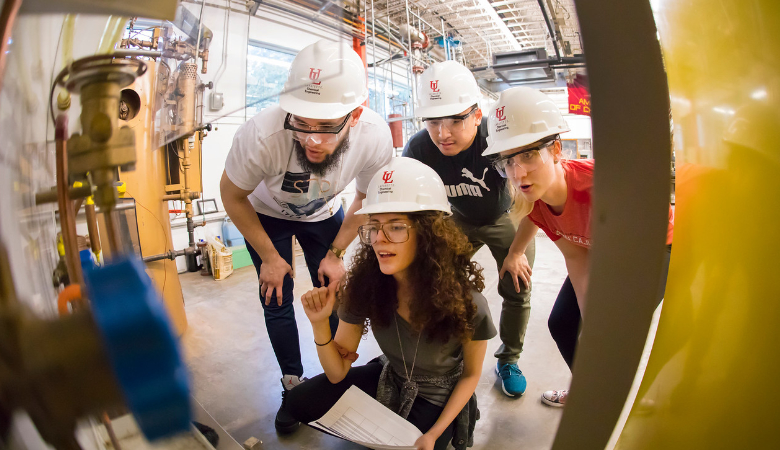 UL Lafayette students wearing hard hats around machinery 