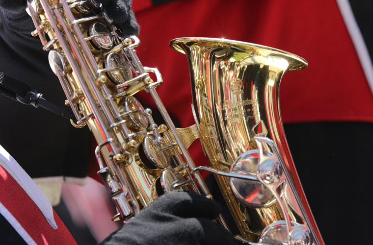 A University of Louisiana at Lafayette music education major playing the saxophone in the Pride of Acadiana marching band