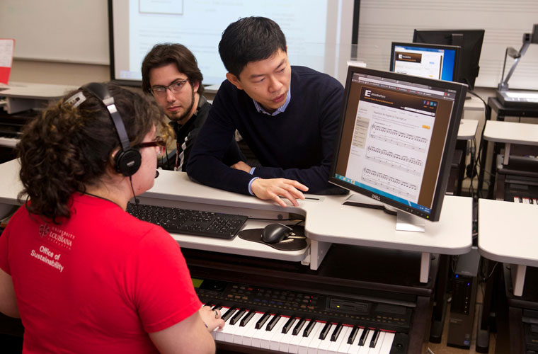 Piano majors at University of Louisiana at Lafayette play on a keyboard in the music department