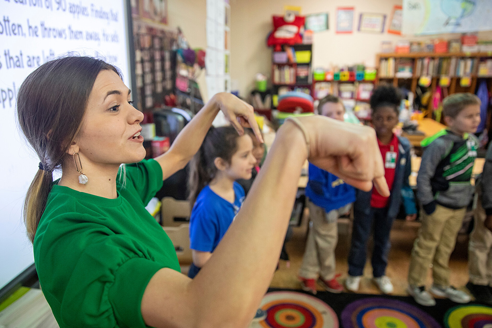A University of Louisiana at Lafayette education major leads student teaching in a classroom with kindergarten students