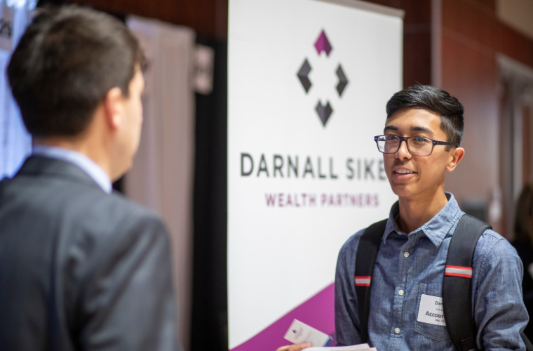 An accounting student talking to a potential employer at the University of Louisiana at Lafayette career fair.