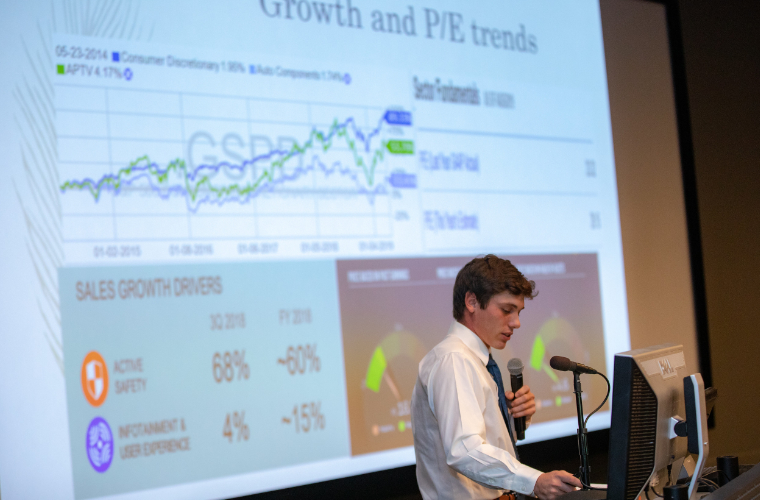 A student at the University of Louisiana at Lafayette presenting on financial trends.