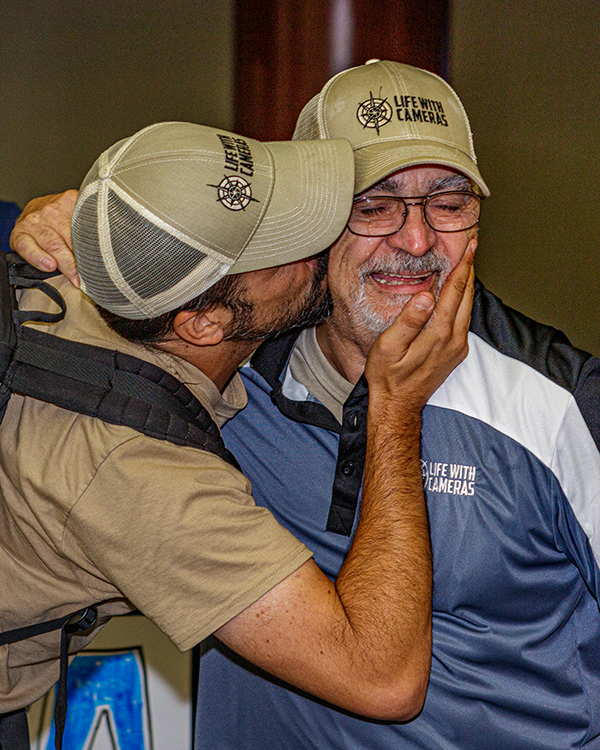 Gordon Eatley's son, Jeffrey, kisses him after an emotional welcome home