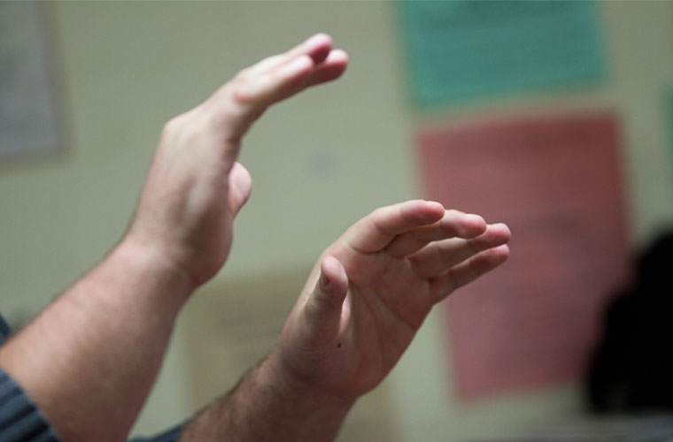 A UL Lafayette arts and music education major conducts in front of a classroom during student teaching