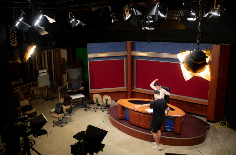 Journalism students preparing to film in a newsroom set on campus at the University of Louisiana at Lafayette.