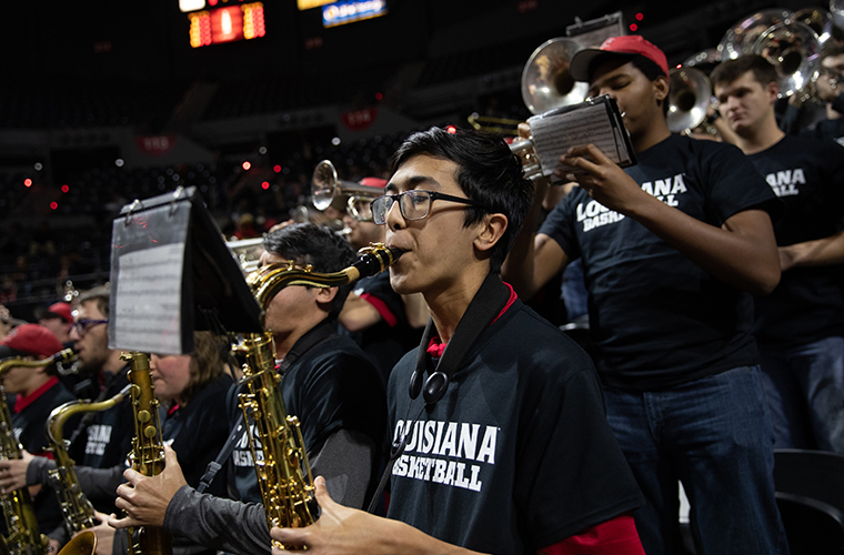 Louisiana Ragin' Brass Band performs at a basketball game in the Cajundome