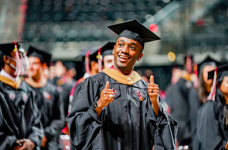 UL Lafayette student gives thumbs up at commencement