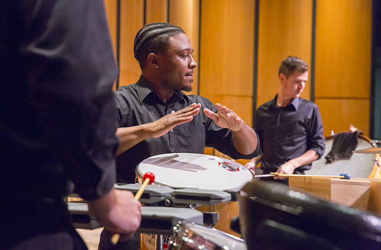 A University of Louisiana at Lafayette music performance major plays percussion during a performance