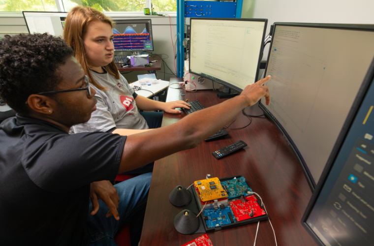 UL Lafayette electrical engineering students working at a computer