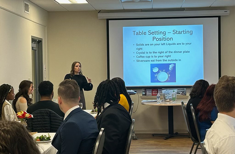 Career Services Director Kim Billeaudeau hosting a workshop on Professional Dinner Etiquette