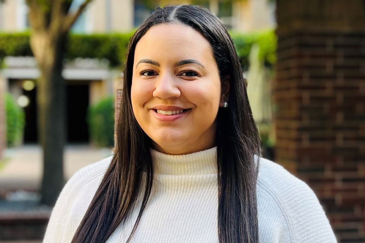 Olivia Larkins, MS, CHES, is an alumna of the online health promotion & wellness bachelor's program. Here, she poses for her headshot for her role as a health IT data analyst for the American Heart Association.