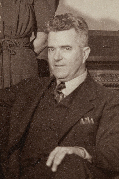 Pothier J. Voorhies wears a suit in this portrait from a black-and-white family photograph in the early 1900s.