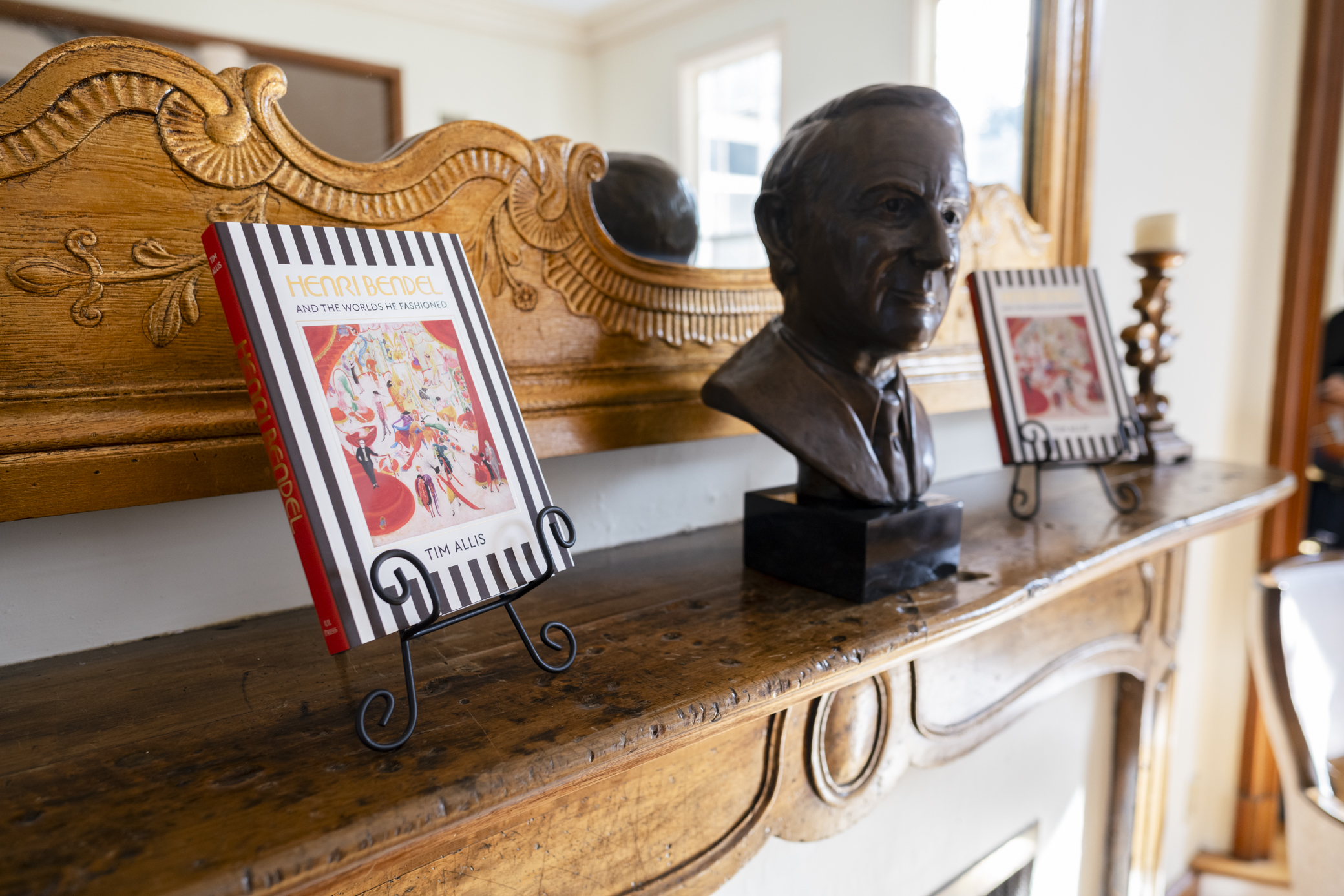 A copy of Henri Bendel book sits on a mantle at the Alumni Center.