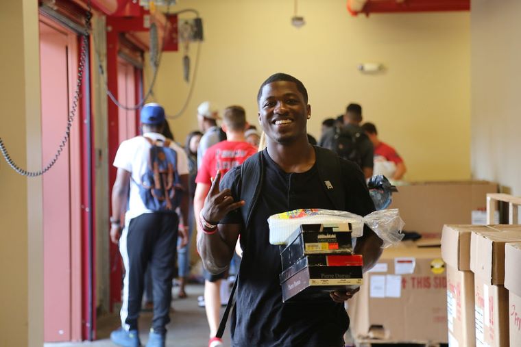 Students sorting donations into boxes