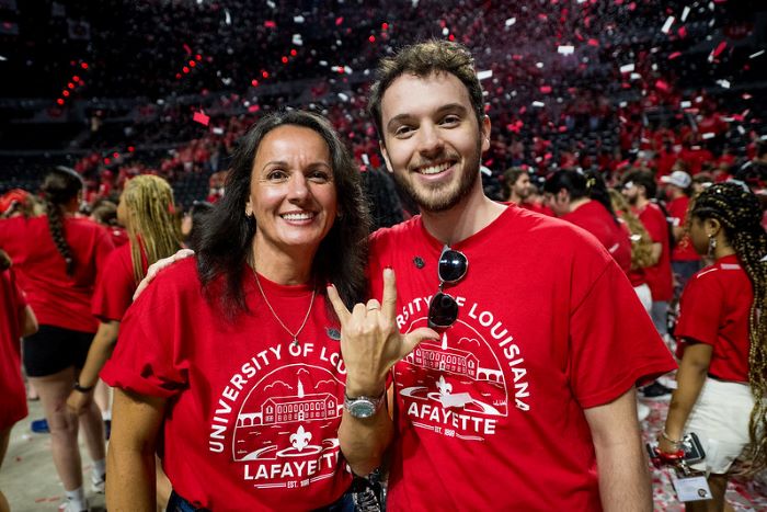 Students at Convocation celebrating as confetti is falling down