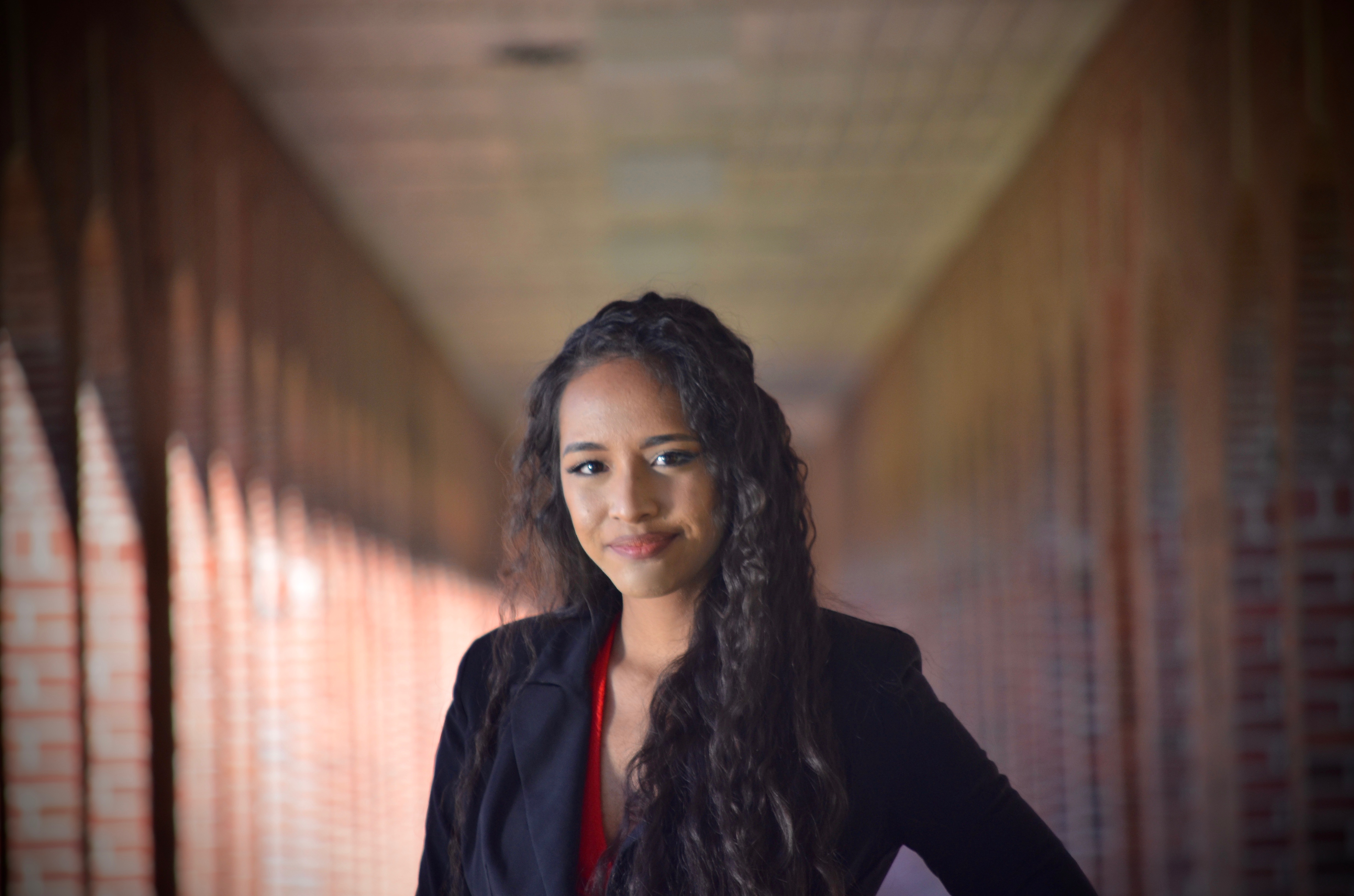 Corinne Salter is pictured under the brick archways of the quad at the University of Louisiana at Lafayette. Corinne earned her bachelor's degree in criminal justice from the University.