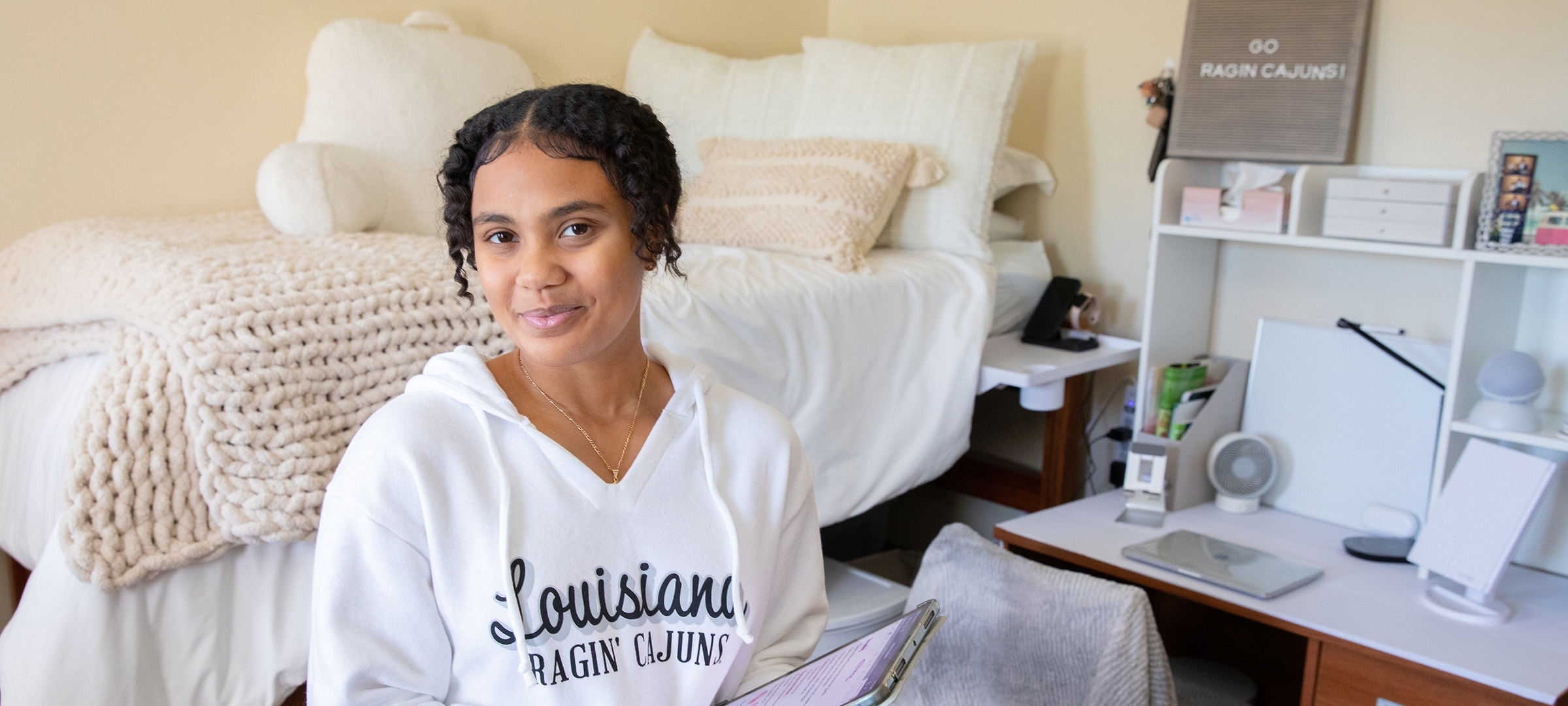 Girl in dorm room at UL Lafayette