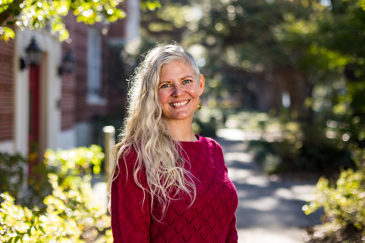 Dr. Emily Sandoz stands outside the Honors building on UL Lafayette's campus.