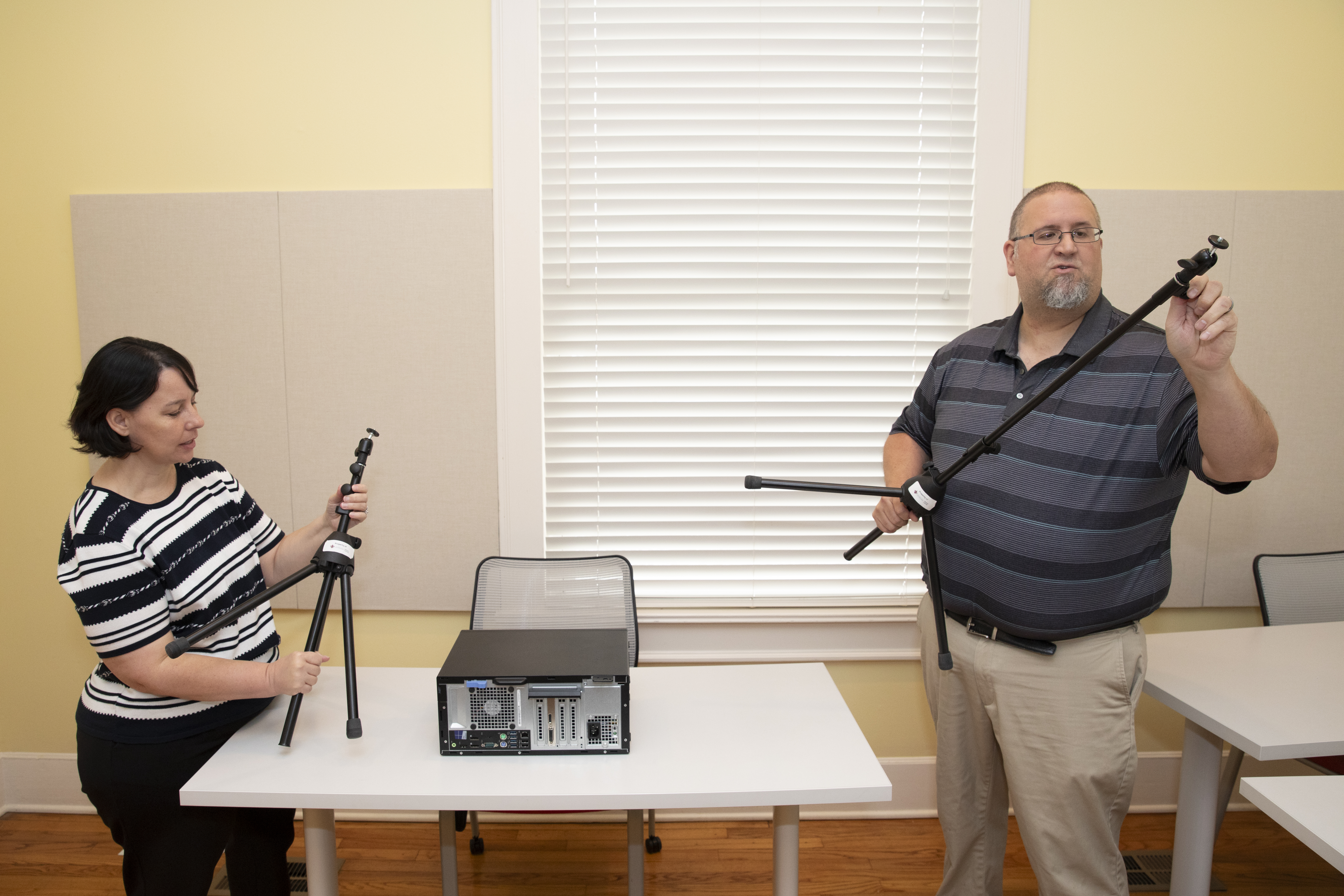 Instructional designer Alise Hagan and Technologist Mike Williams are pictured assembling tripods available as part of the Office of Distance Learning equipment library.