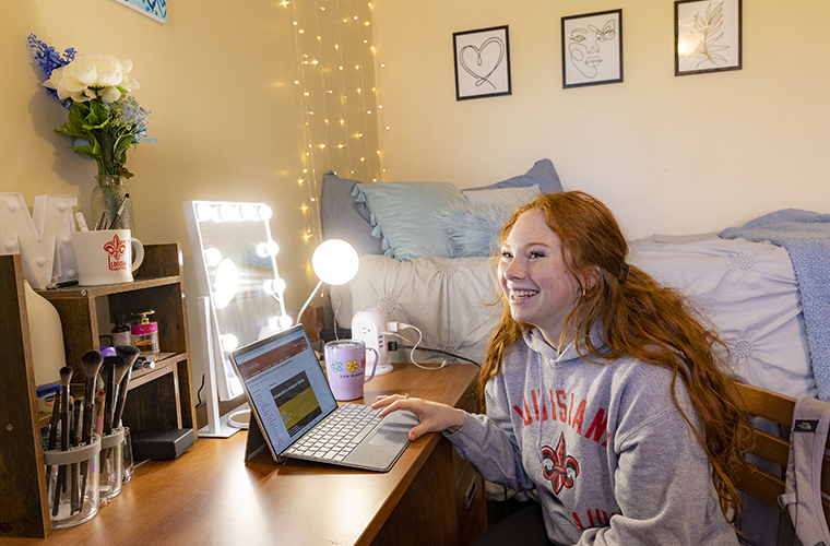 UL Lafayette student in her dorm room