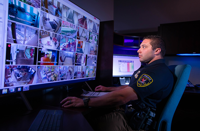UL police officer at security monitor