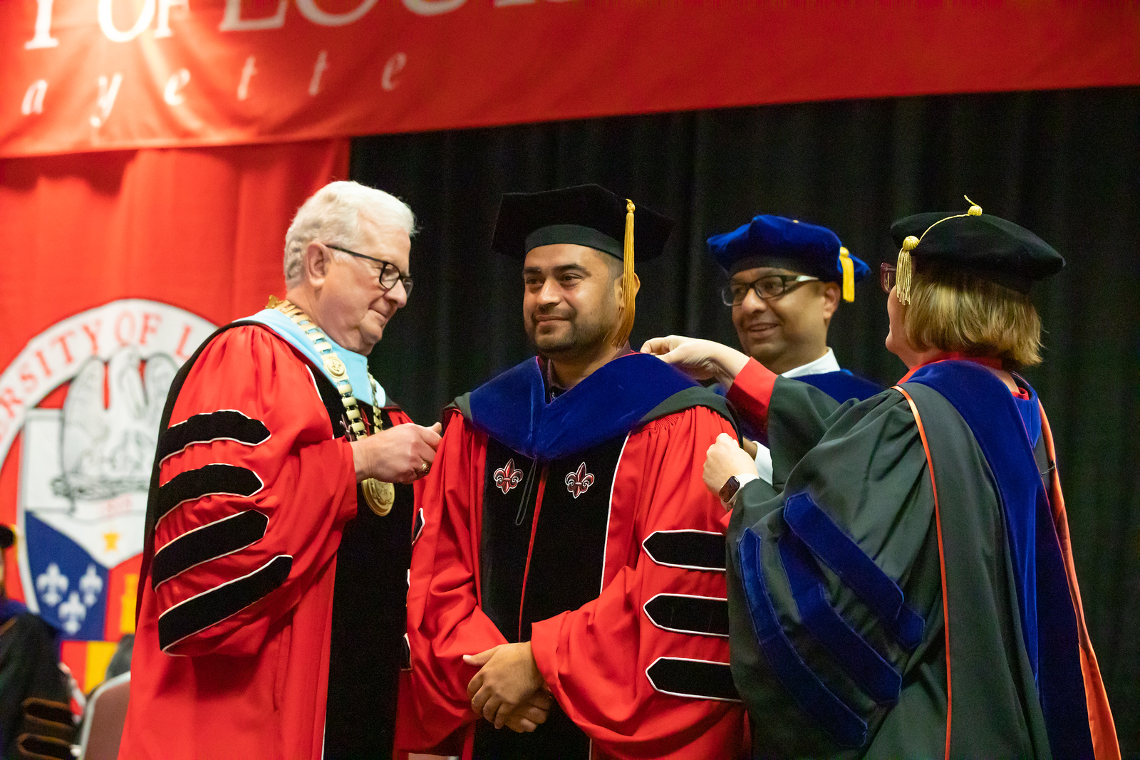 Doctoral Hooding with Dr. Savoie and Dr. Farmer-Kaiser