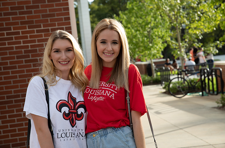 UL Lafayette students in front of dorms