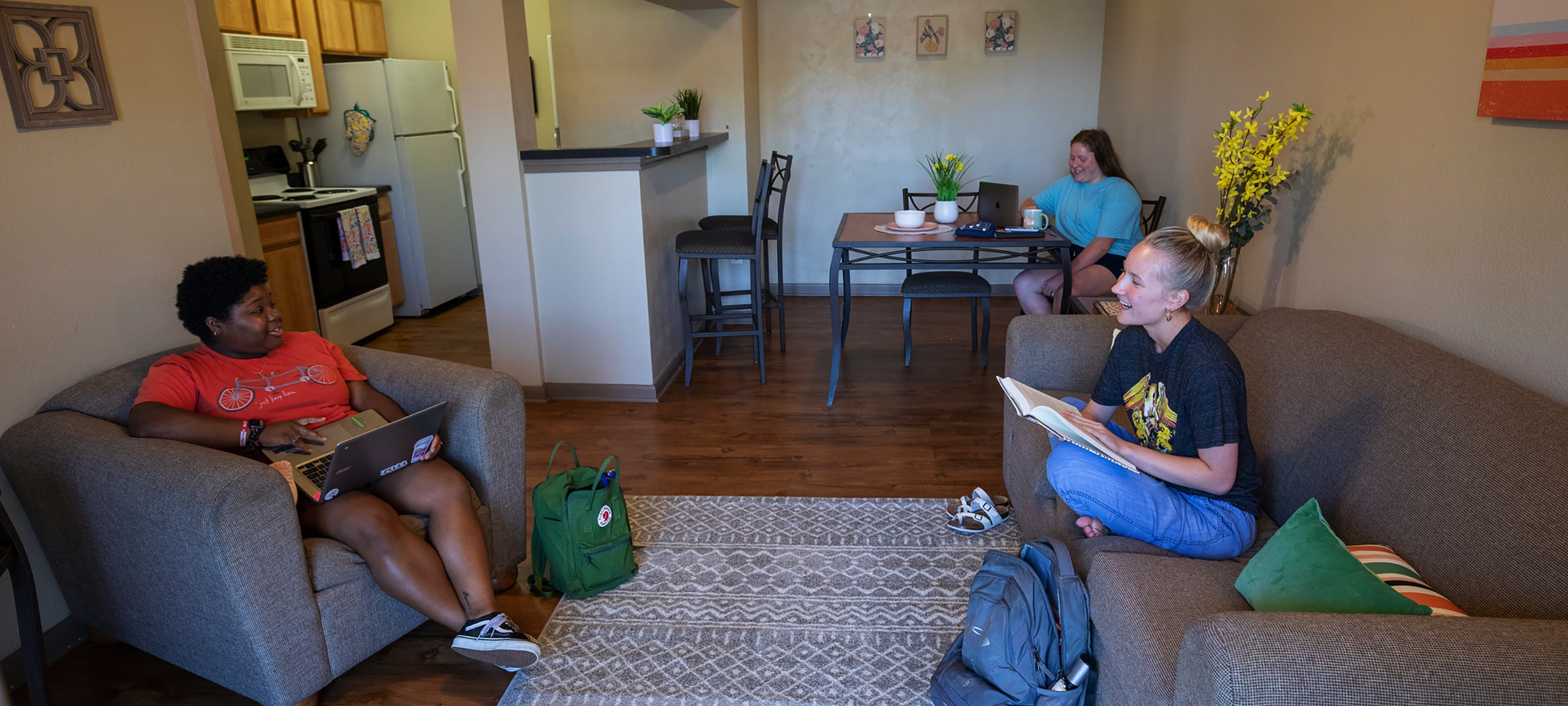 Students sit in a Legacy Park apartment living room