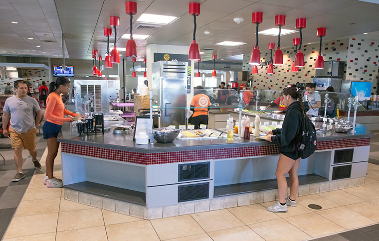 Students making salads at Cypress Lake Dining Hall