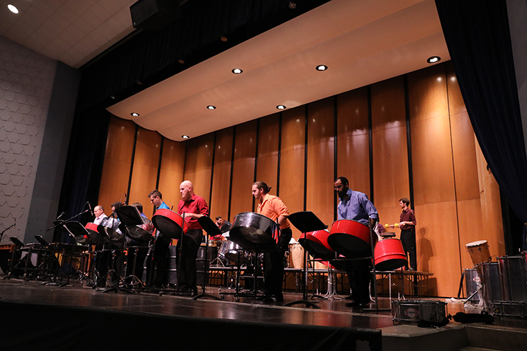 Percussion instruments being played on the stage at Angelle Hall