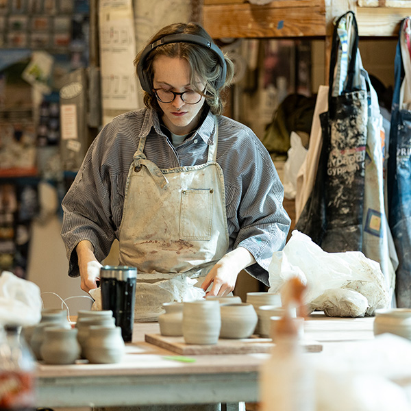 UL Lafayette ceramics student working in the studio.