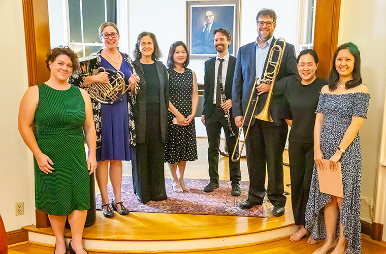 School of Music faculty members stand together after a collaborative performance
