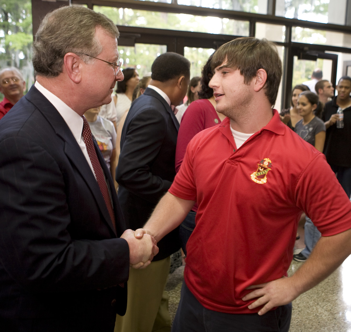 Dr. Savoie meets Robert Reichert, a member of Kappa Sigma fraternity during an ice cream social held on his first day on campus as UL Lafayette's president.