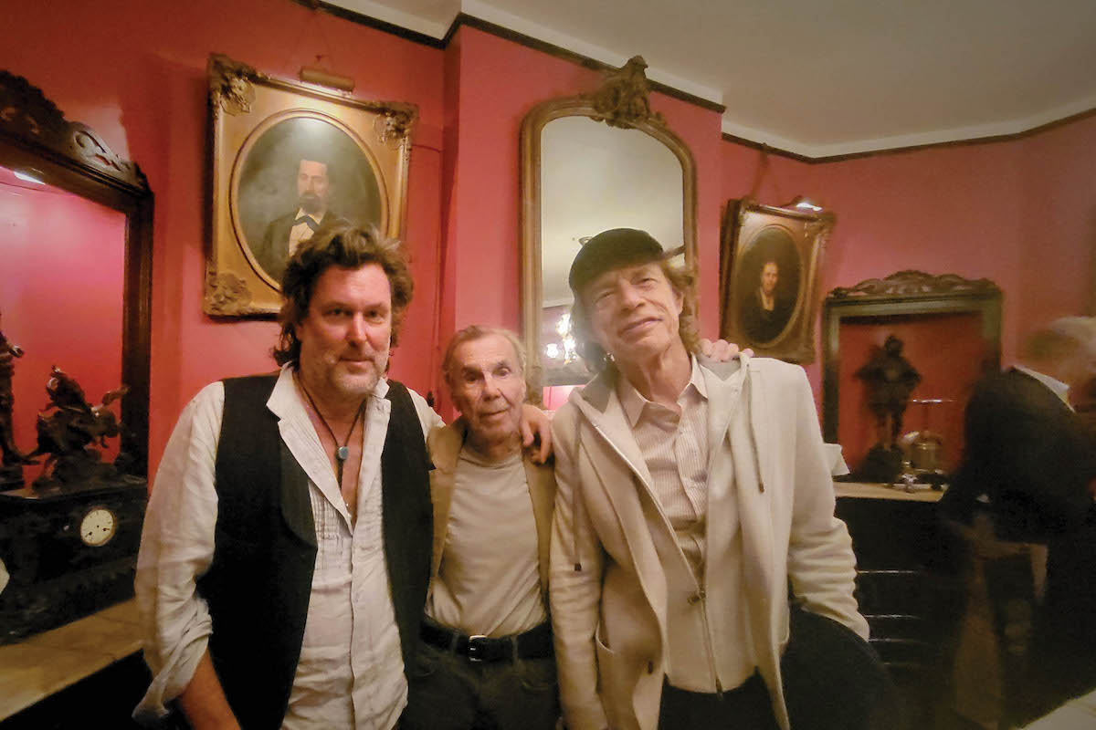 CC Adcock, Dickie Landry and Mick Jagger at Antoine's Restaurant in New Orleans.