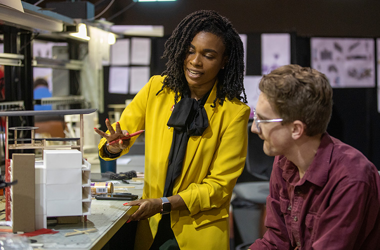 UL Lafayette architectural studies professor assessing a student's work one-on-one