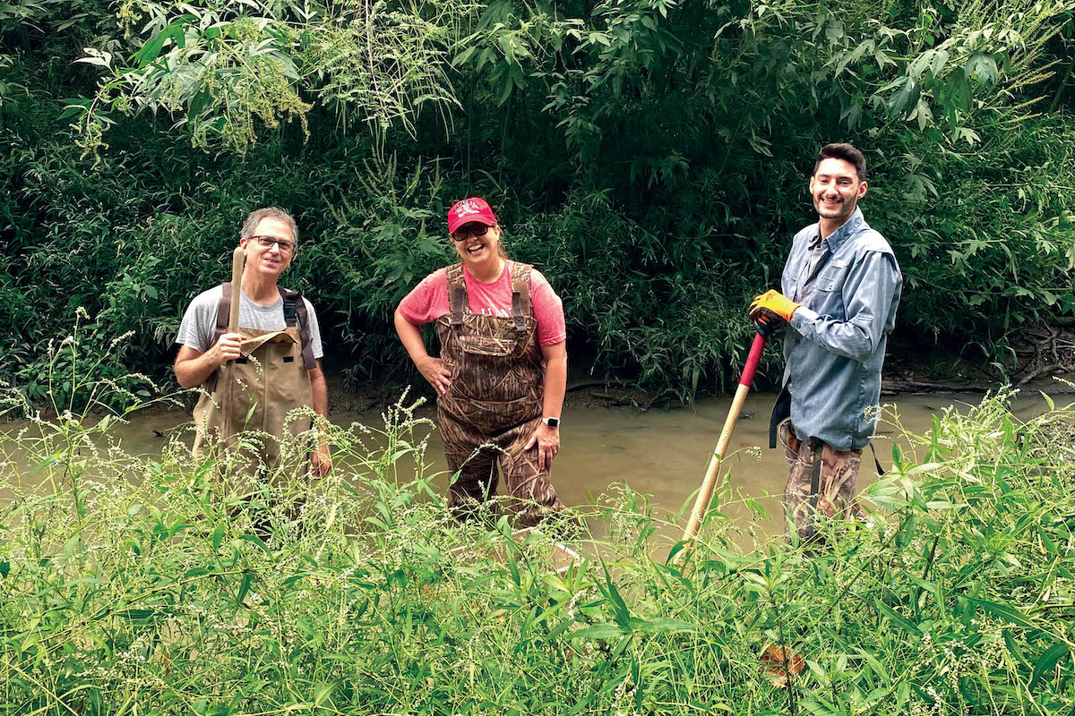 UL Lafayette Science Museum director Jennifer Hargrave, a volunteer and graduate student help to uncover a mastodon tooth in Church Point, Louisiana.