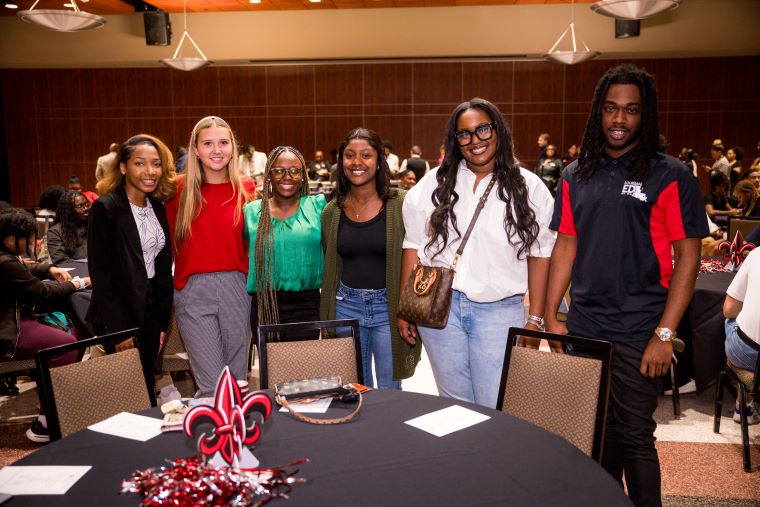 A group of LEP students smiling at an event