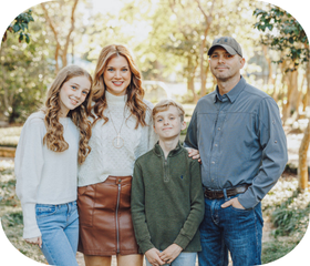 Graduate of the online informatics program pictured with her husband, son, and daughter.