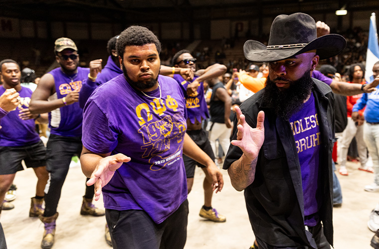UL Lafayette Omega Psi Phi fraternity members dancing.