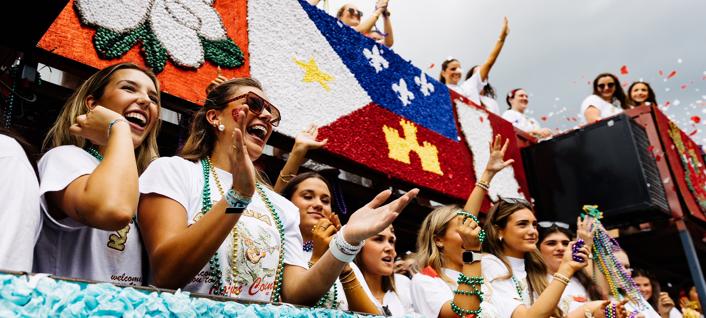 UL Lafayette sorority members on a homecoming float.