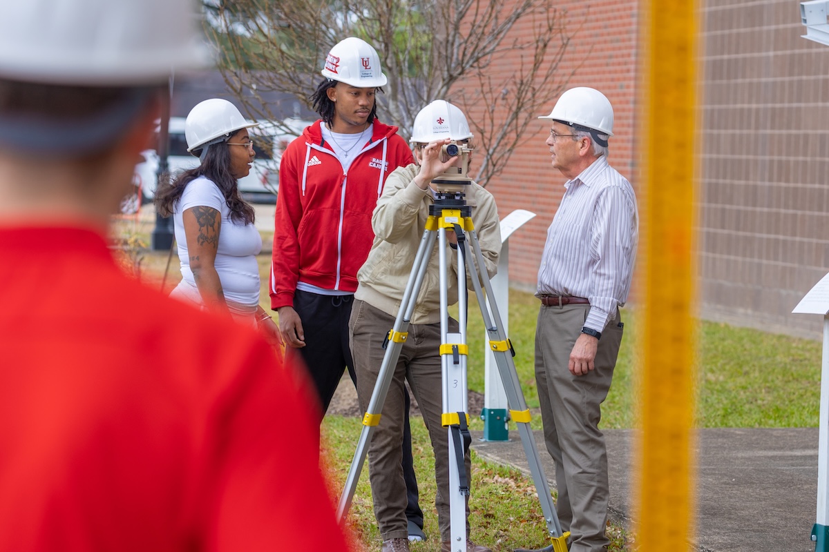 Engineering students and faculty on a job site