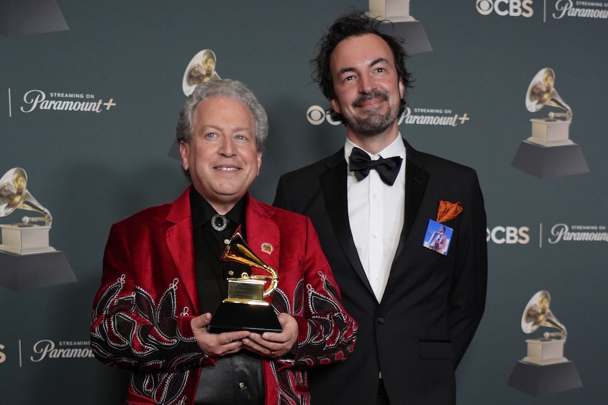 John Leopold and Joel Savoy hold a Grammy Award at the 68th Annual Grammy Awards.