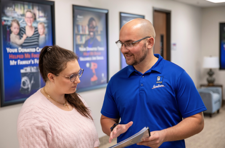 Marketing alumni collaborates with the communication team at Goodwill Acadiana. 