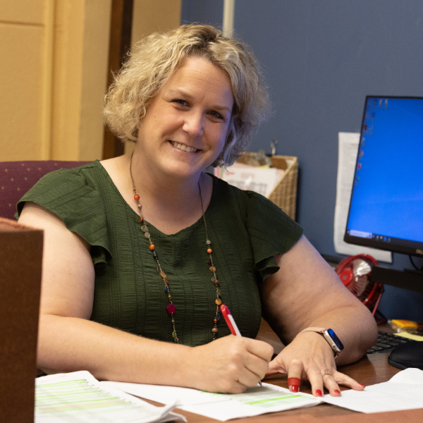 UL Lafayette staff member filling out forms.