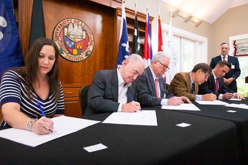 A signing ceremony for the UL Lafayette-UNamur student exchange